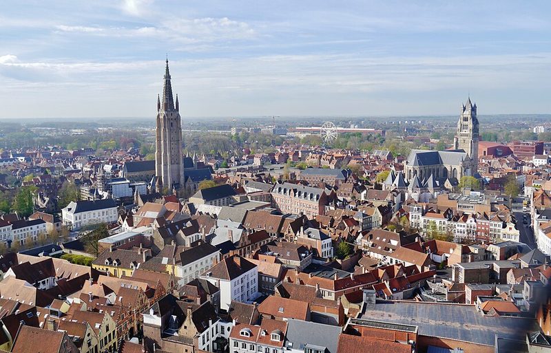 View over Bruges rooftops, canals and medieval towers in the historic centre
